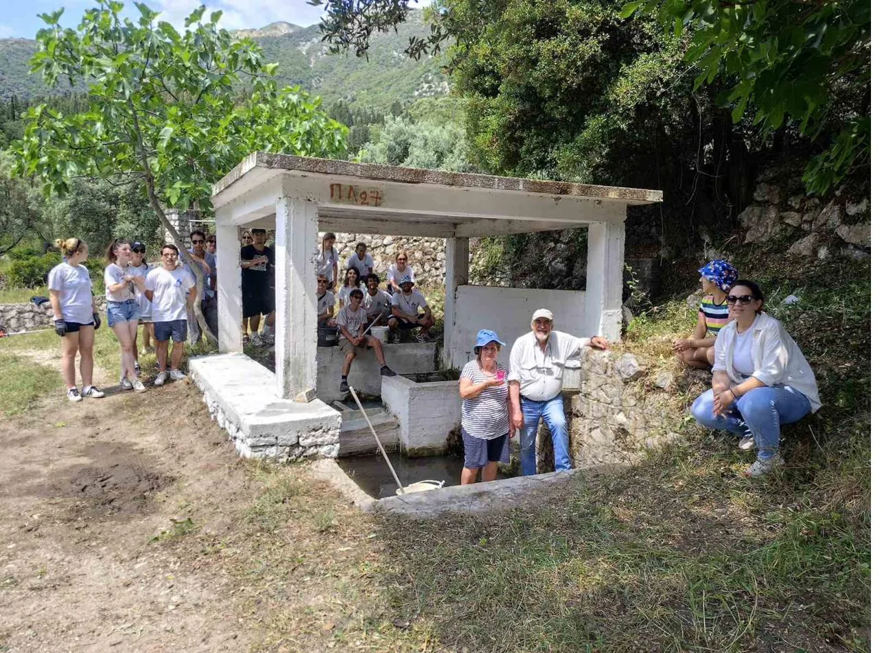 Volunteers cleaning the Melanydros spring in Neochori, Lefkada